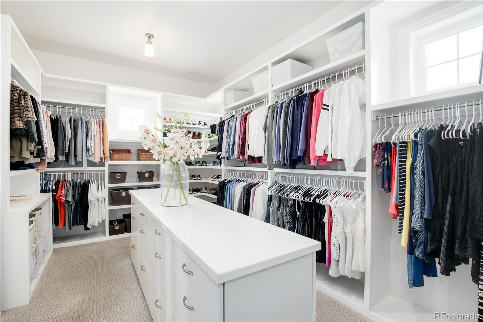 10890 Rainribbon Road Highlands Ranch, CO 80126 - Photo 22 of 40 a view of walk in closet with clothes