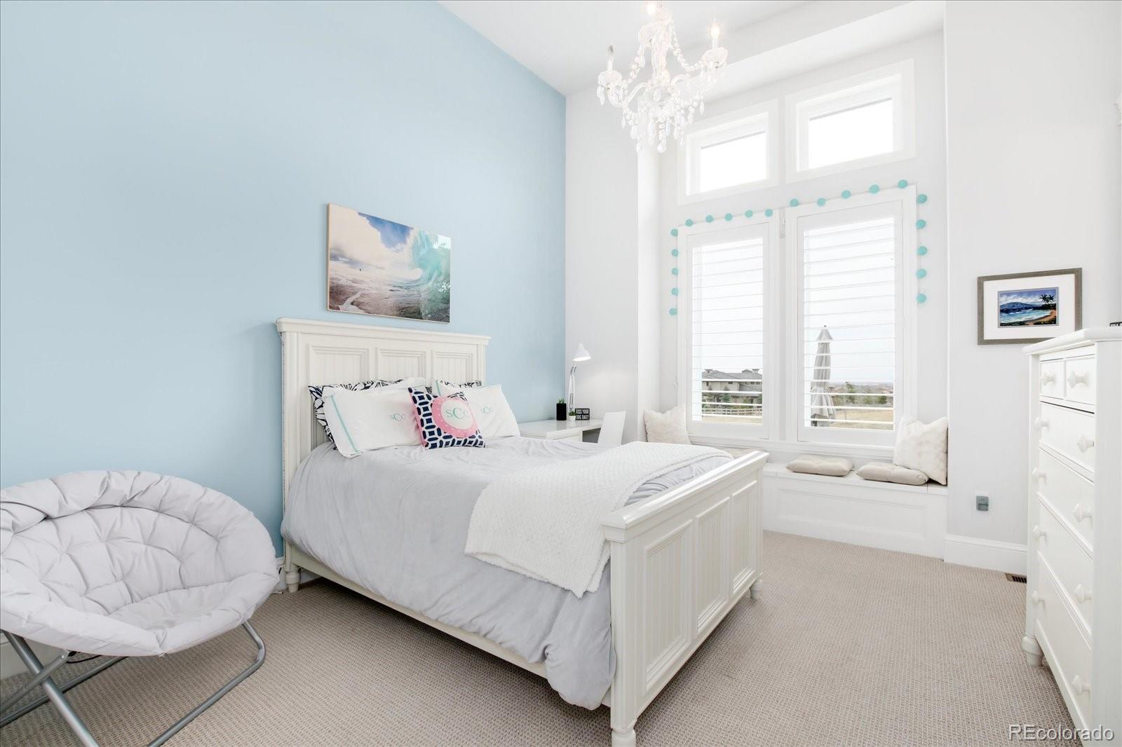 10890 Rainribbon Road Highlands Ranch, CO 80126 - Photo 23 of 40 a bedroom with a bed and a window