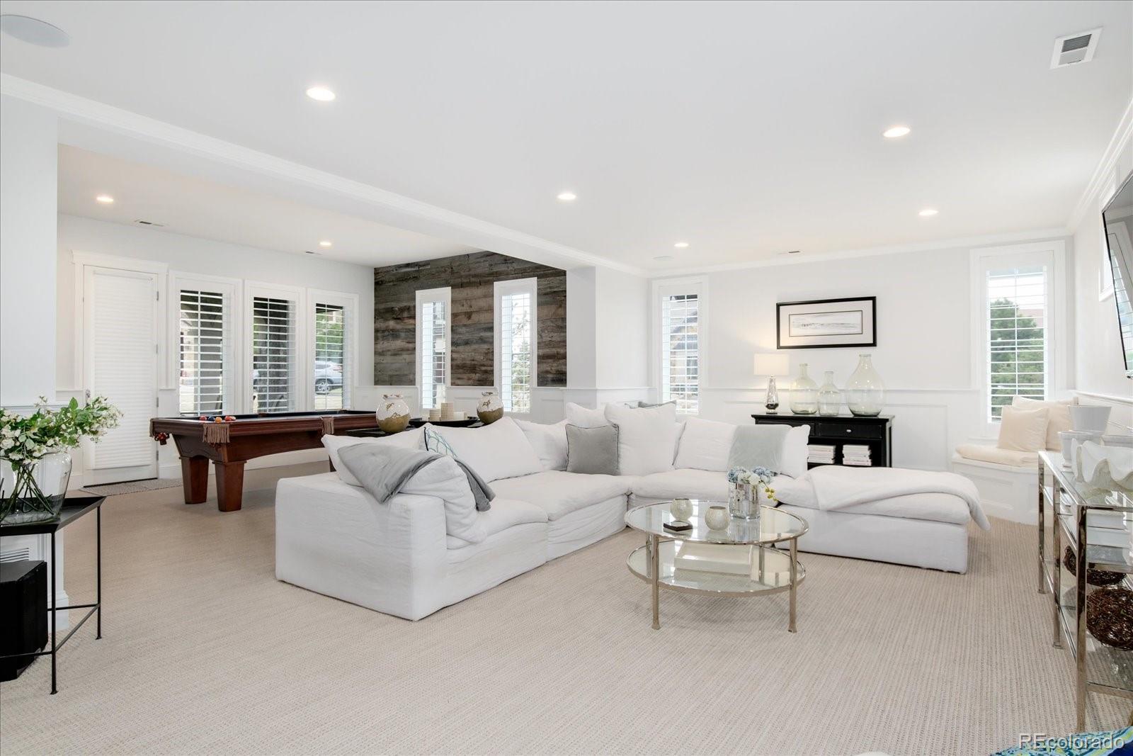 10890 Rainribbon Road Highlands Ranch, CO 80126 - Photo 31 of 40 a living room with furniture and a large window