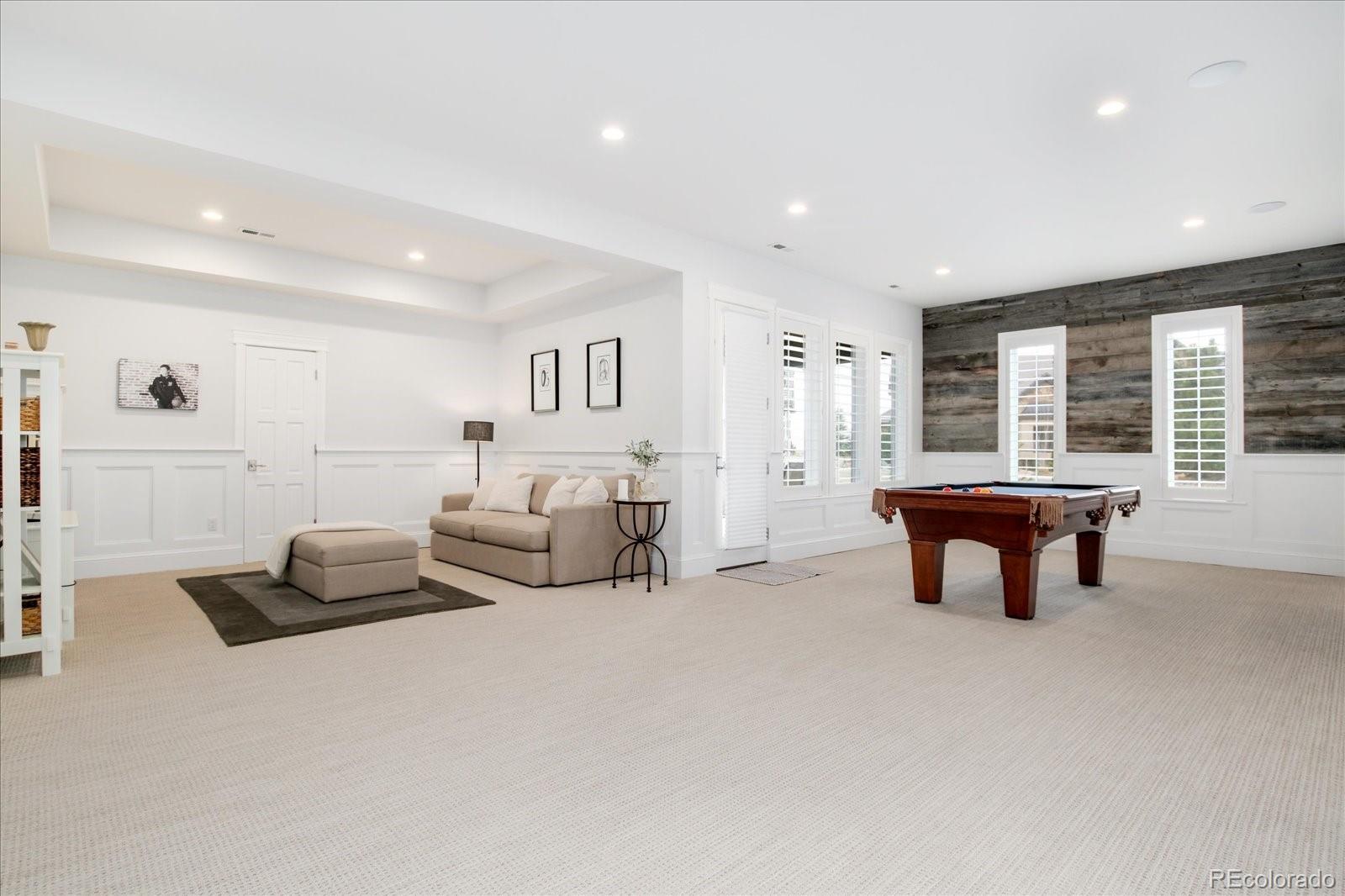 10890 Rainribbon Road Highlands Ranch, CO 80126 - Photo 32 of 40 a bedroom with furniture and a window