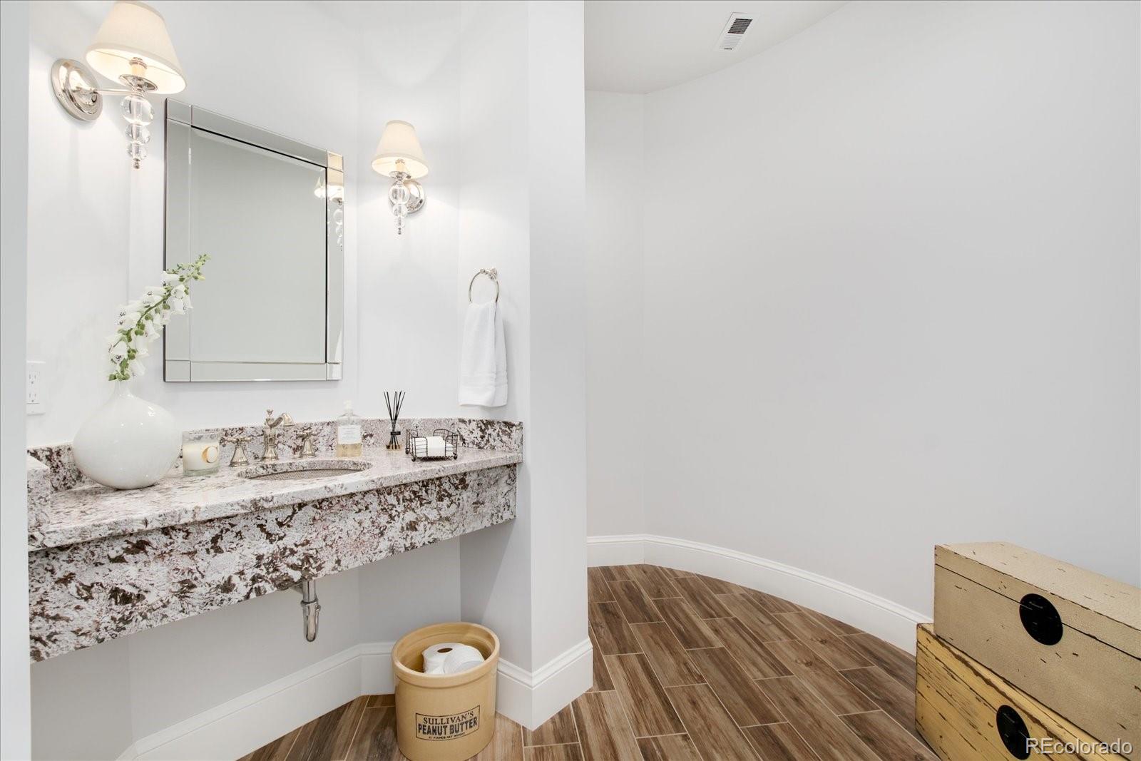 10890 Rainribbon Road Highlands Ranch, CO 80126 - Photo 36 of 40 a bathroom with a sink and a mirror