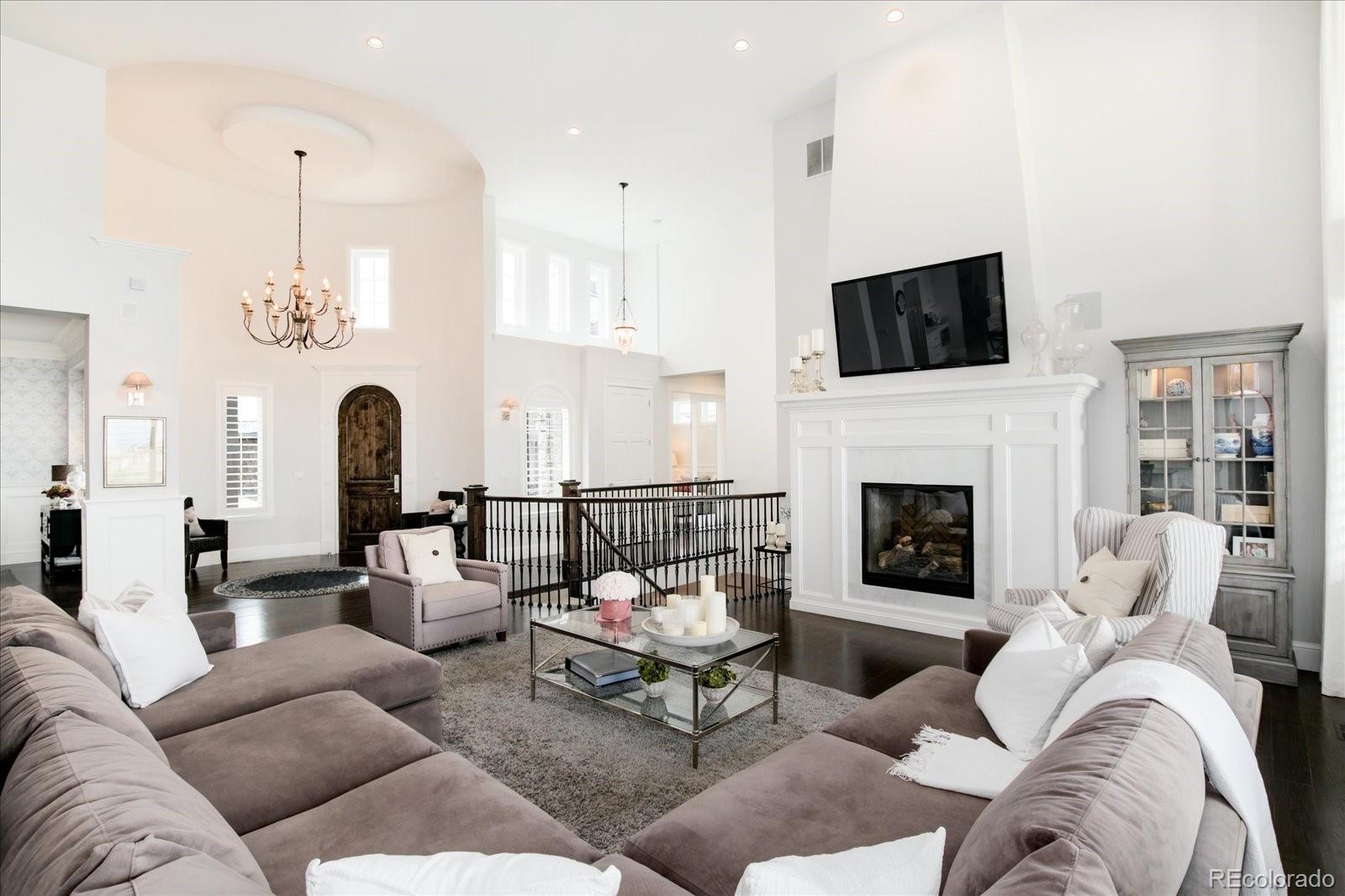 10890 Rainribbon Road Highlands Ranch, CO 80126 - Photo 7 of 40 a living room with furniture fireplace and flat screen tv