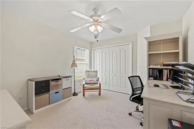 a view of a workspace with furniture