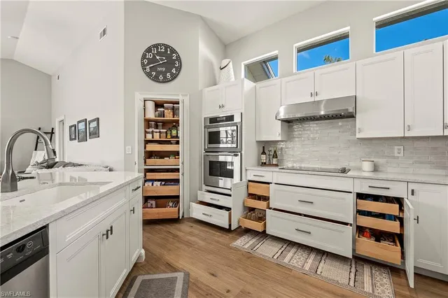 a kitchen with stainless steel appliances cabinets and a kitchen