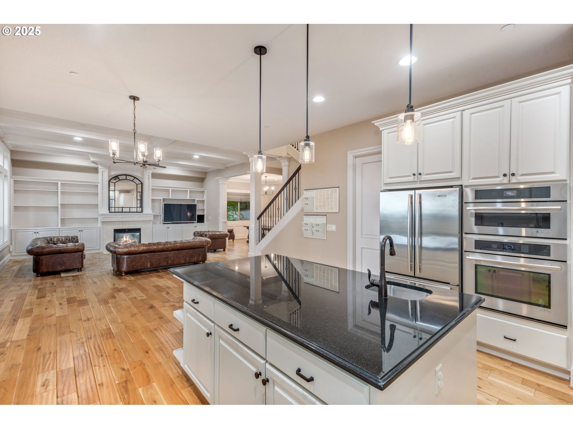 4530 Southwest Council Crest Drive Portland, OR 97239 - Photo 11 of 43 a kitchen with kitchen island a counter top space appliances and a ceiling fan