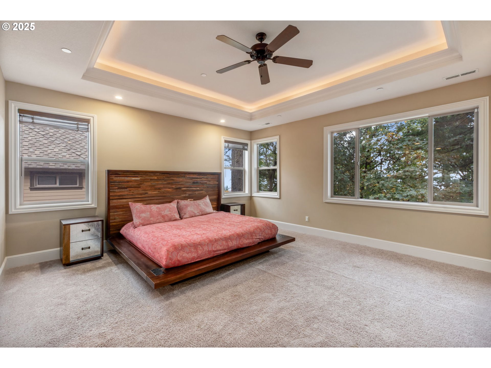 4530 Southwest Council Crest Drive Portland, OR 97239 - Photo 18 of 43 a spacious bedroom with a bed and a large window