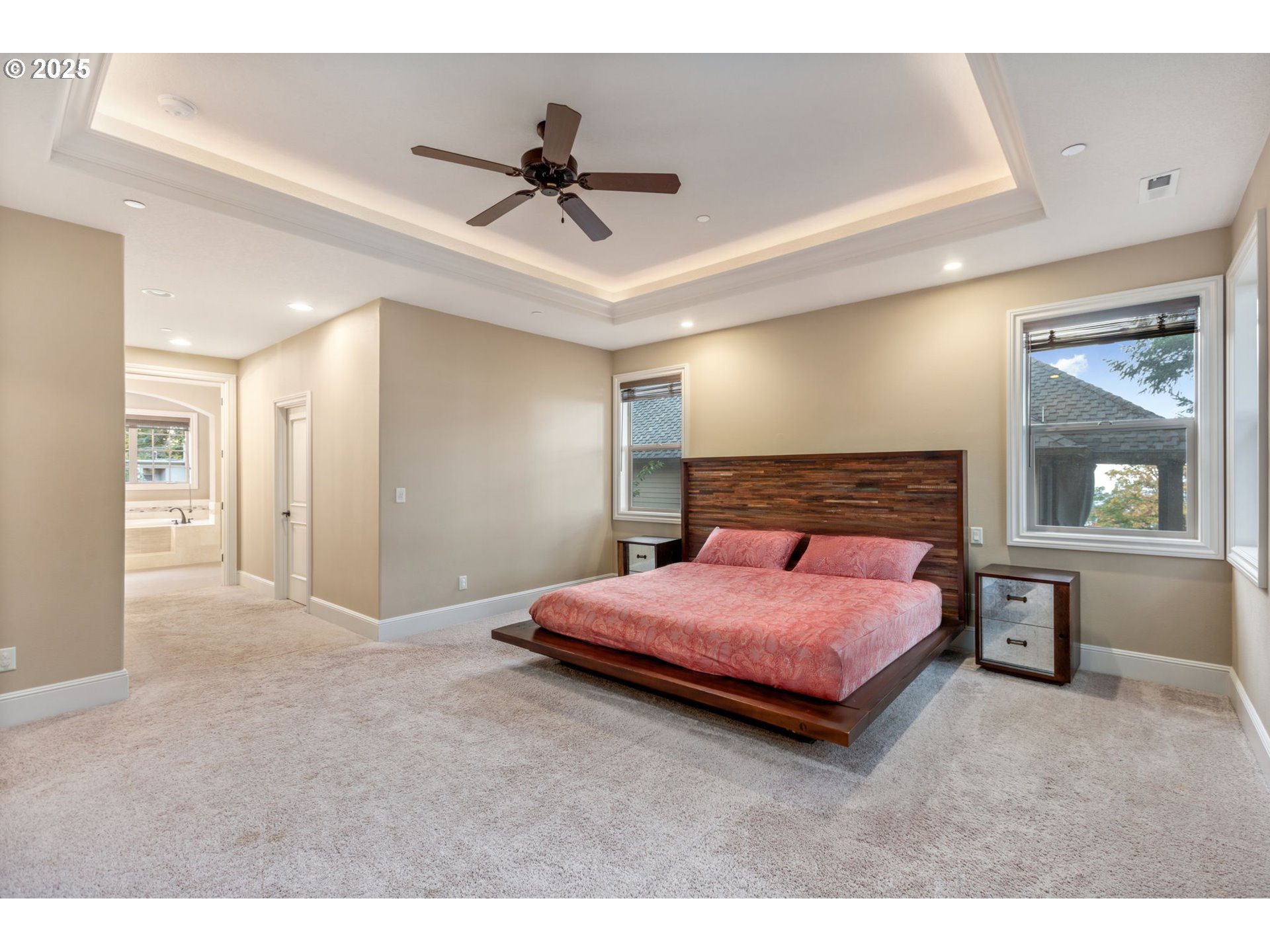 4530 Southwest Council Crest Drive Portland, OR 97239 - Photo 20 of 43 a bedroom with a bed and a large mirror