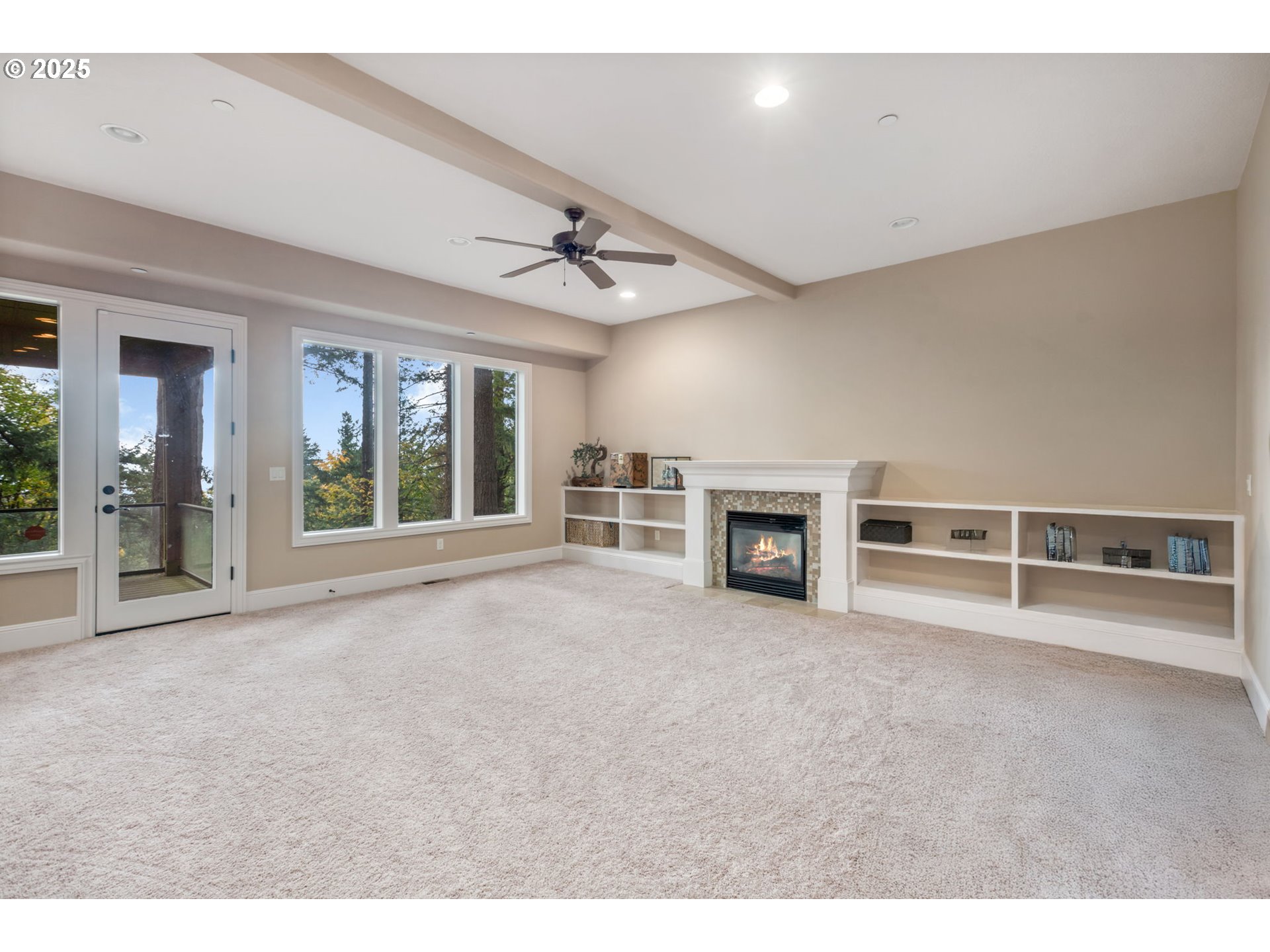4530 Southwest Council Crest Drive Portland, OR 97239 - Photo 31 of 43 a view of an empty room with a fireplace and a window