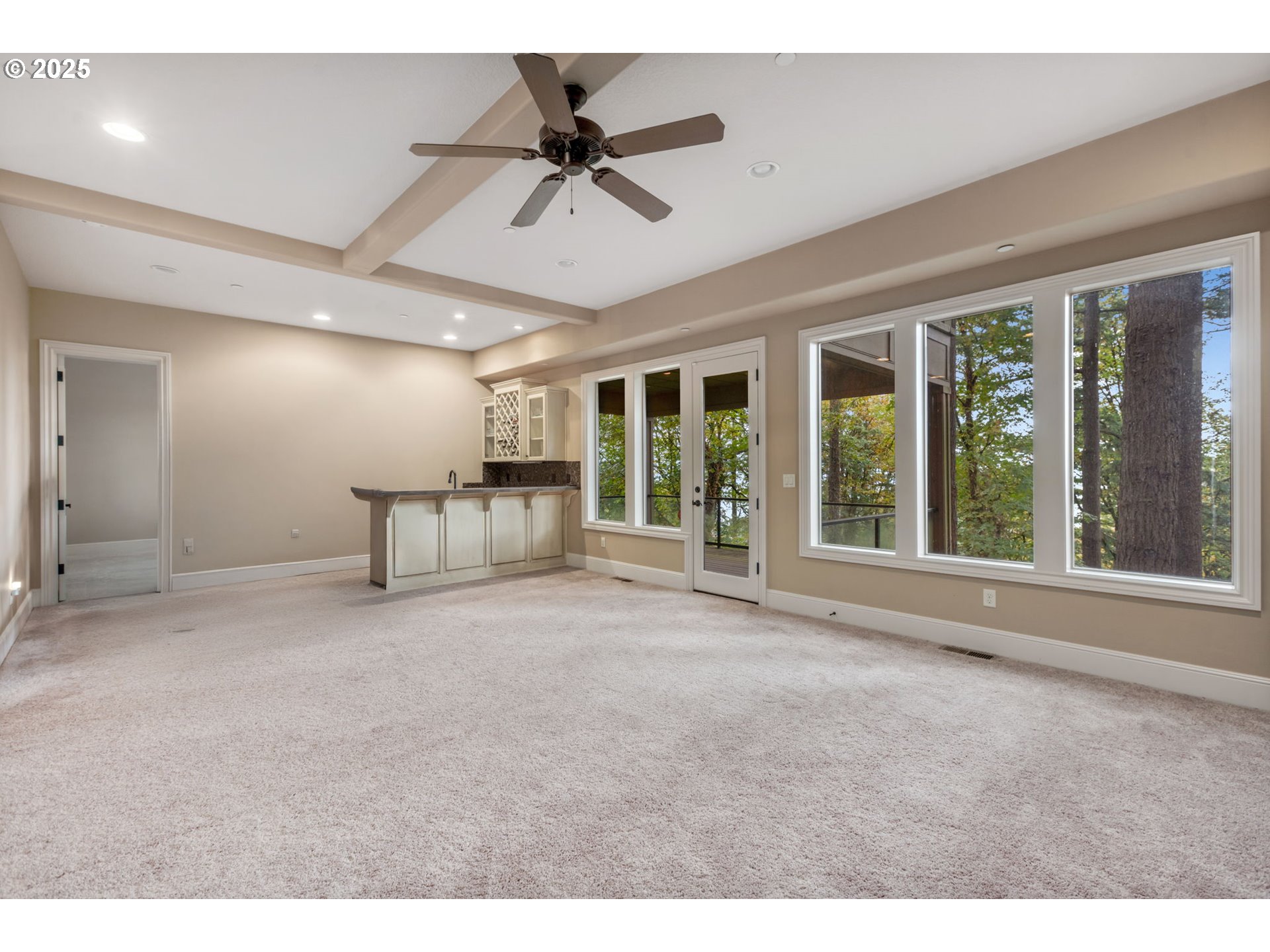 4530 Southwest Council Crest Drive Portland, OR 97239 - Photo 33 of 43 a view of an empty room with a window and a ceiling fan