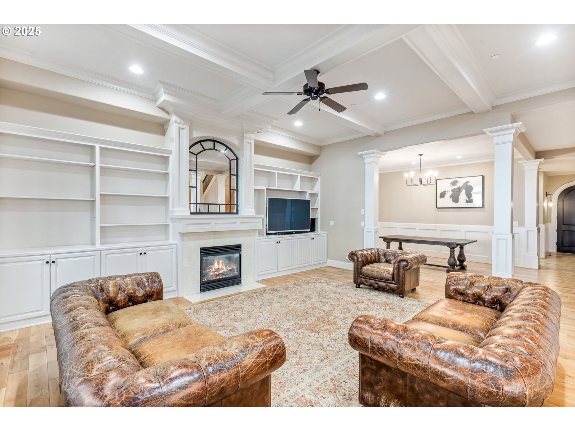 4530 Southwest Council Crest Drive Portland, OR 97239 - Photo 5 of 43 a living room with furniture a fireplace and a flat screen tv