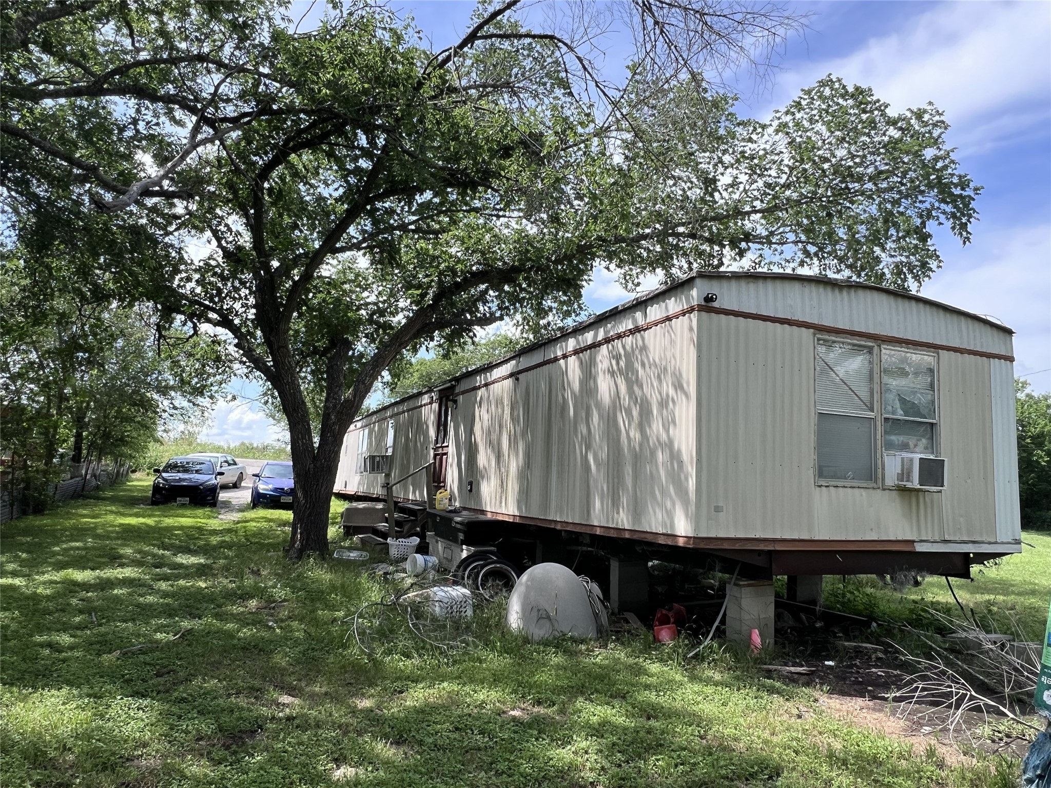 10001 Peterson Road Del Valle, TX 78617 - Photo 21 of 29 a house view with a garden space