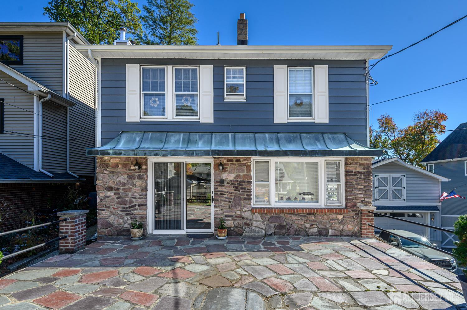 a front view of a house with yard