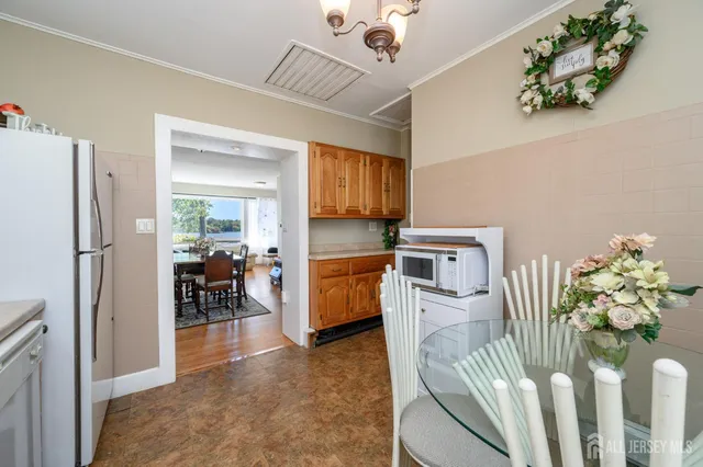 a kitchen with stainless steel appliances a refrigerator and cabinets