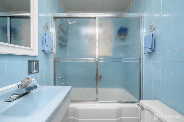 a room with furniture and a potted plant