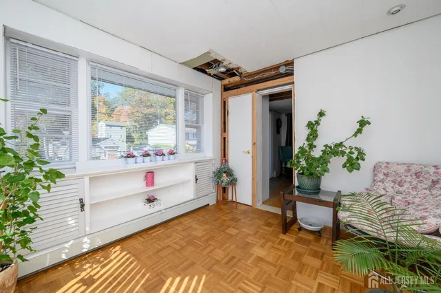 a view of a house with a yard and a wooden fence