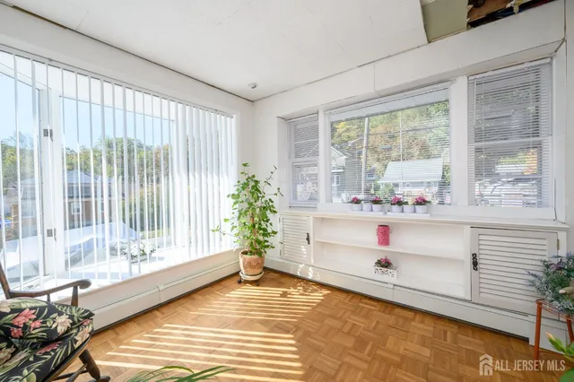a view of a chairs and table in backyard