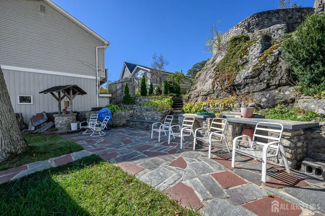an aerial view of a house with a lake view