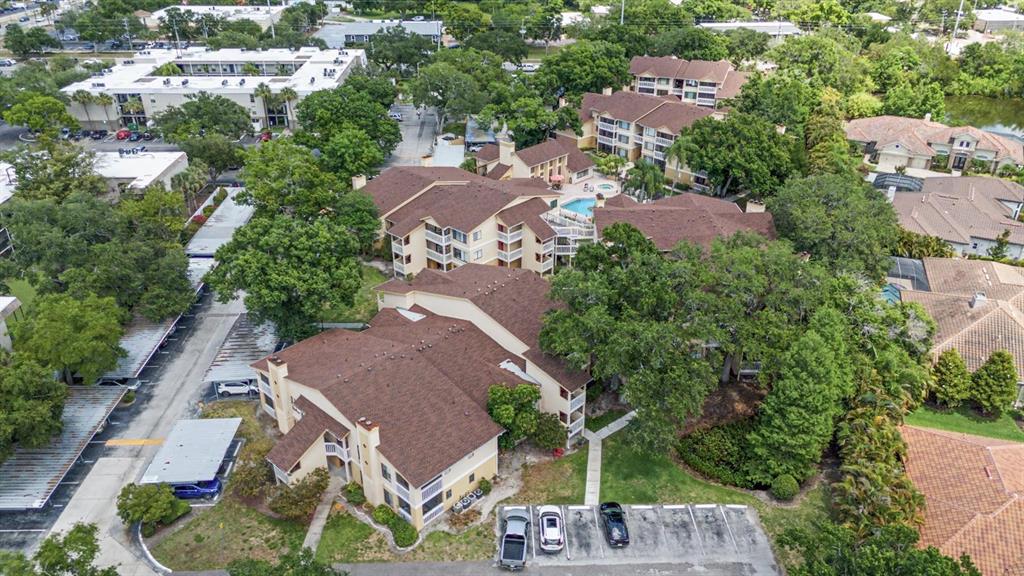 1550 South Belcher Road, Unit 525 Clearwater, FL 33764 - Photo 26 of 28 an aerial view of multiple houses with yard