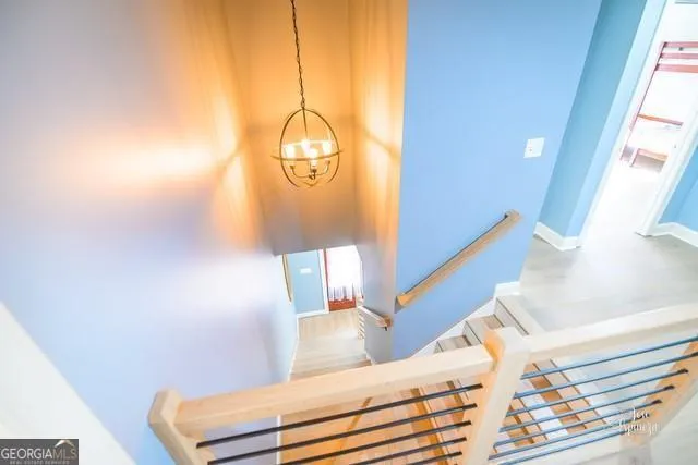 a view of staircase with wooden floor