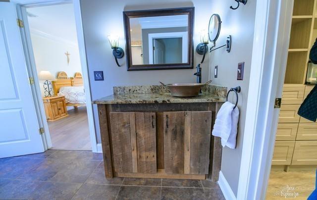 355 Golf View Drive Cohutta, GA 30710 - Photo 20 of 41 a bathroom with a granite countertop sink a mirror and a vanity