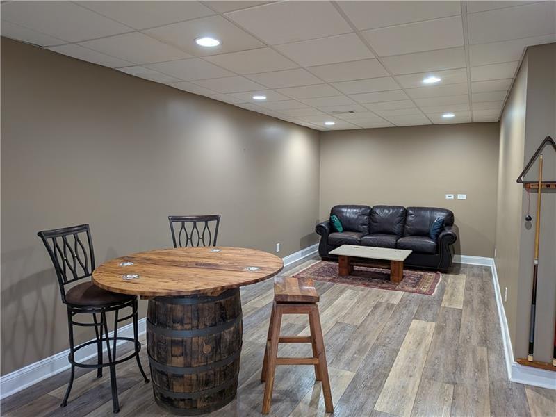 355 Golf View Drive Cohutta, GA 30710 - Photo 29 of 45 a living room with furniture a wooden floor and a table