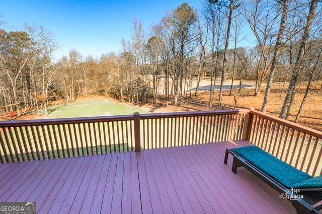 355 Golf View Drive Cohutta, GA 30710 - Photo 36 of 45 a balcony with wooden floor and trees