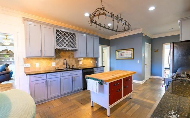 355 Golf View Drive Cohutta, GA 30710 - Photo 9 of 41 a kitchen with stainless steel appliances granite countertop a stove a sink dishwasher and cabinets with wooden floor