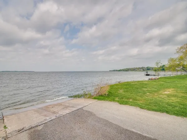 a view of a lake with a big yard