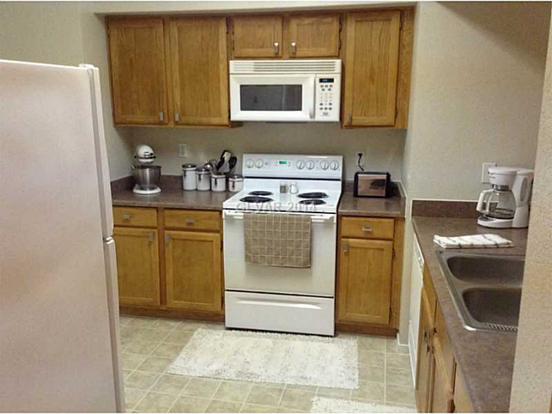 9620 West Russell Road, Unit 1015 Las Vegas, NV 89148 - Photo 4 of 22 Kitchen. LOOKING IN FROM KITCHEN DOORWAY.