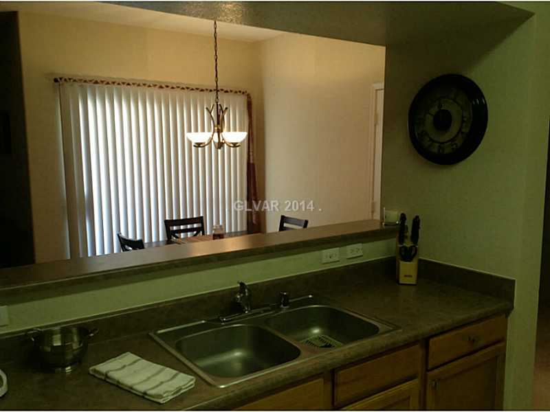 9620 West Russell Road, Unit 1015 Las Vegas, NV 89148 - Photo 7 of 22 Kitchen. UPGRADED COUNTERS, CHANDELIER AND TWO TONE PAINT!