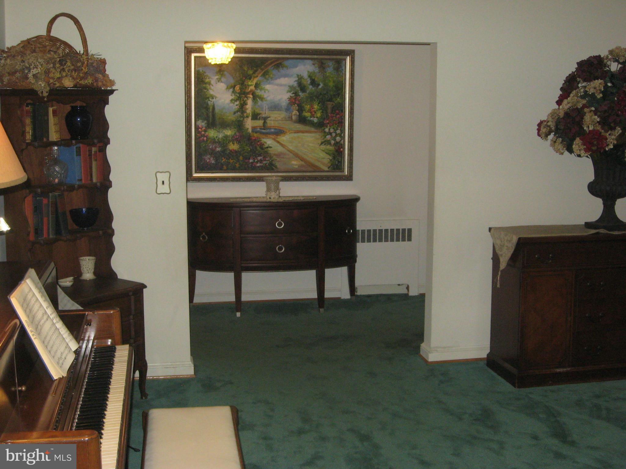 14709 Claude Lane Silver Spring, MD 20905 - Photo 2 of 21 a living room with furniture and a painting on the wall