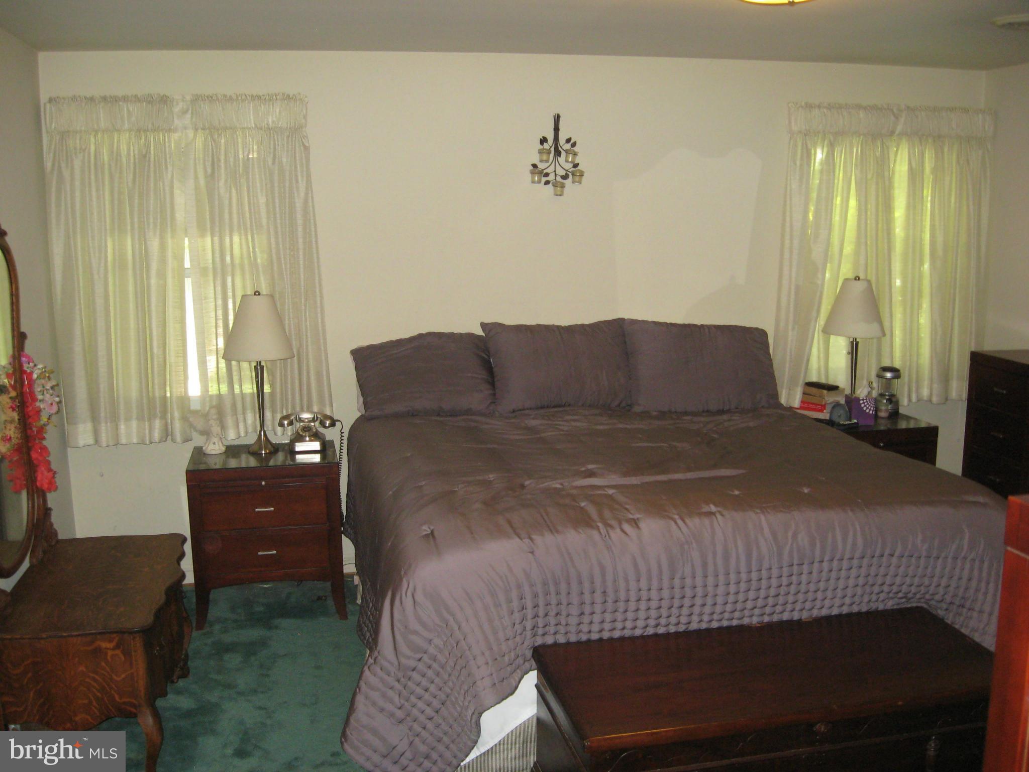 14709 Claude Lane Silver Spring, MD 20905 - Photo 19 of 21 a bedroom with a bed and window