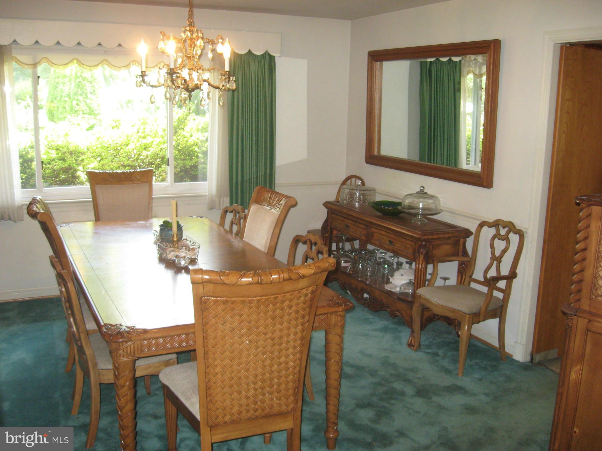 14709 Claude Lane Silver Spring, MD 20905 - Photo 4 of 21 a view of a dining room with furniture window and outside view