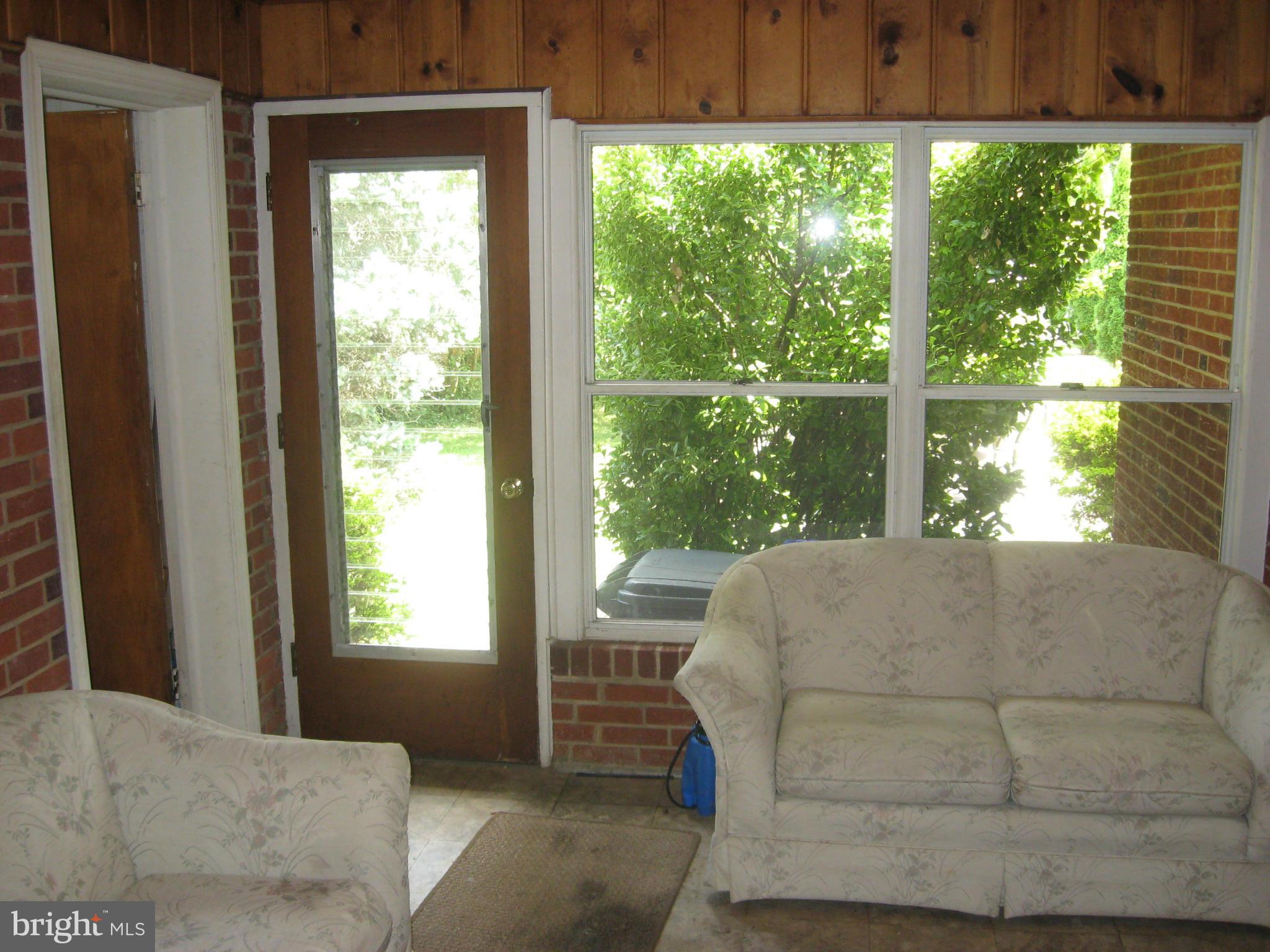 14709 Claude Lane Silver Spring, MD 20905 - Photo 6 of 21 a bed sitting in a bedroom next to a window