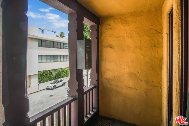 a view of a door and wooden floor