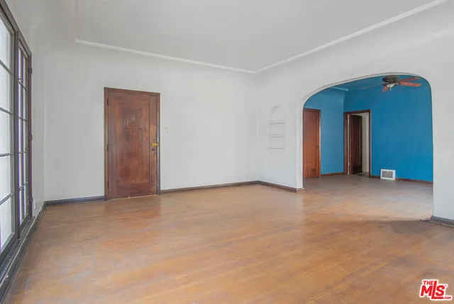 a view of an empty room with a closet