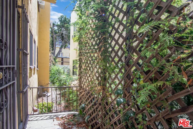 a view of a house with a tree