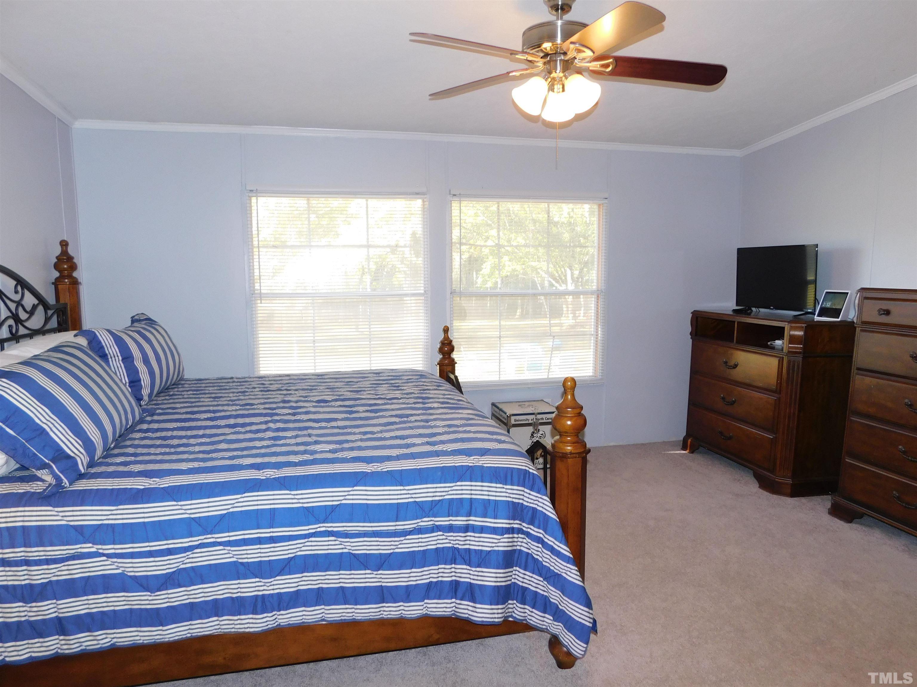 7180 Driver Road Zebulon, NC 27597 - Photo 11 of 19 a bedroom with furniture and a window