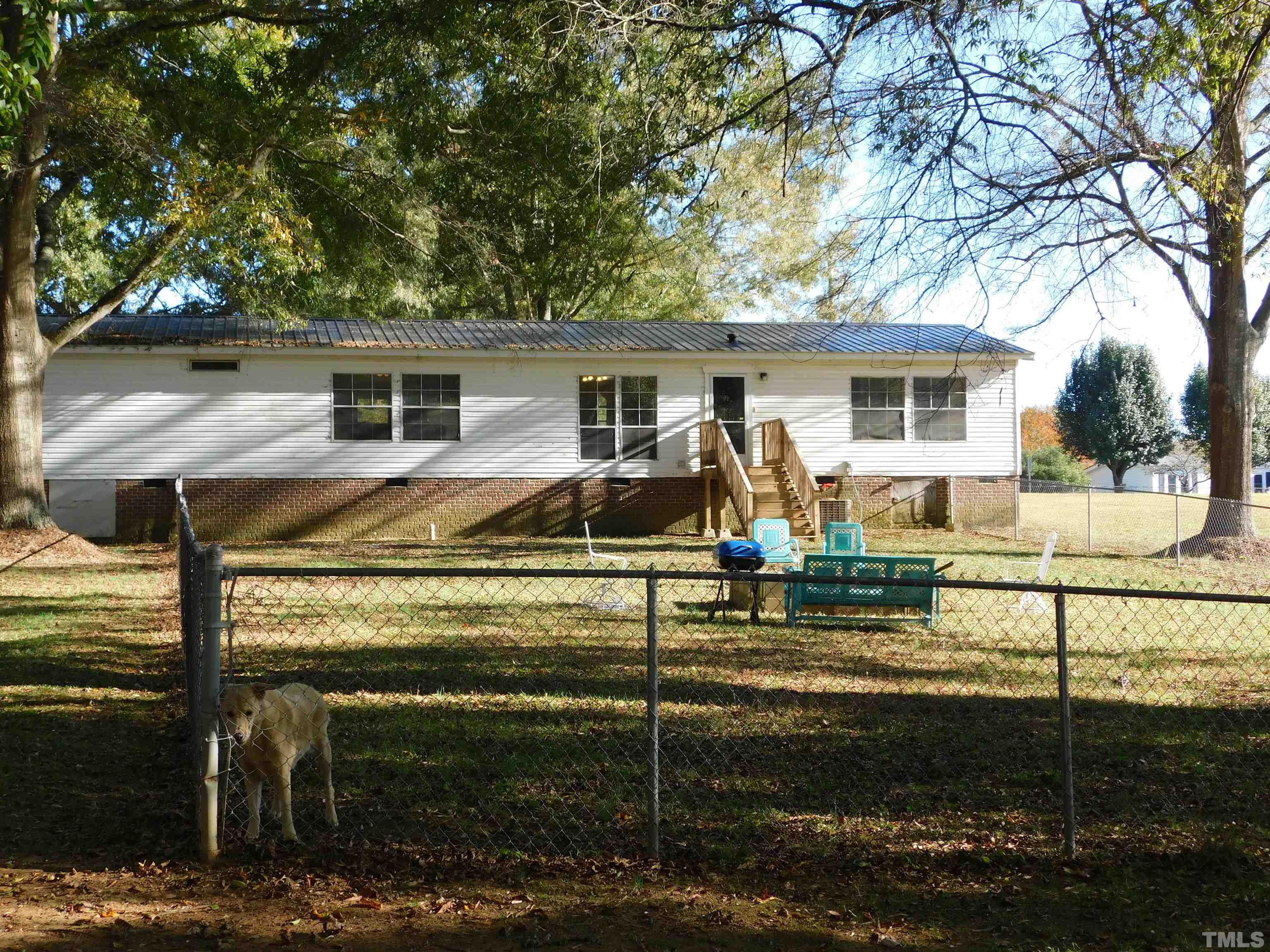 7180 Driver Road Zebulon, NC 27597 - Photo 19 of 19 a view of a house with a yard
