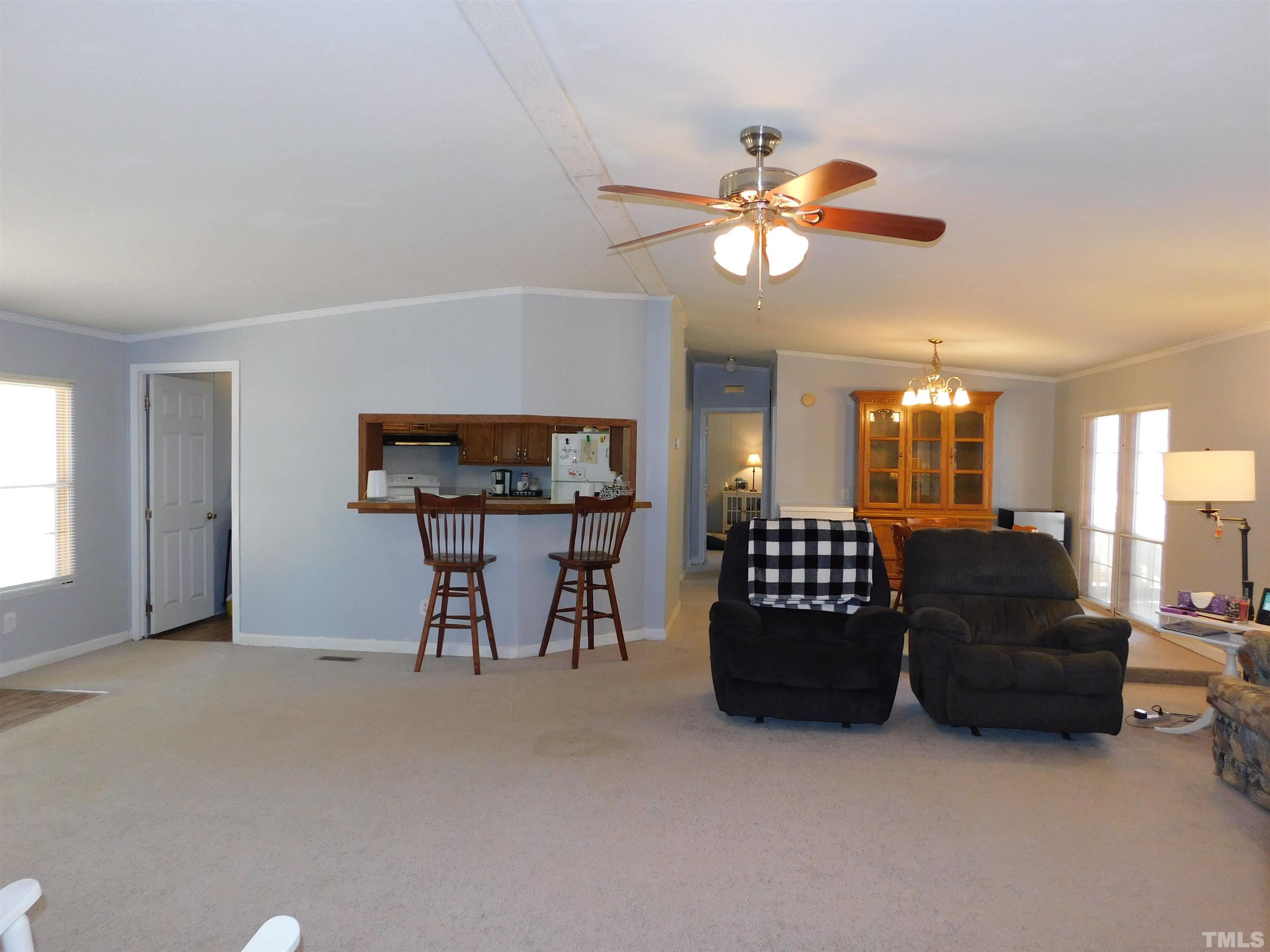 7180 Driver Road Zebulon, NC 27597 - Photo 4 of 19 a living room with furniture and a window