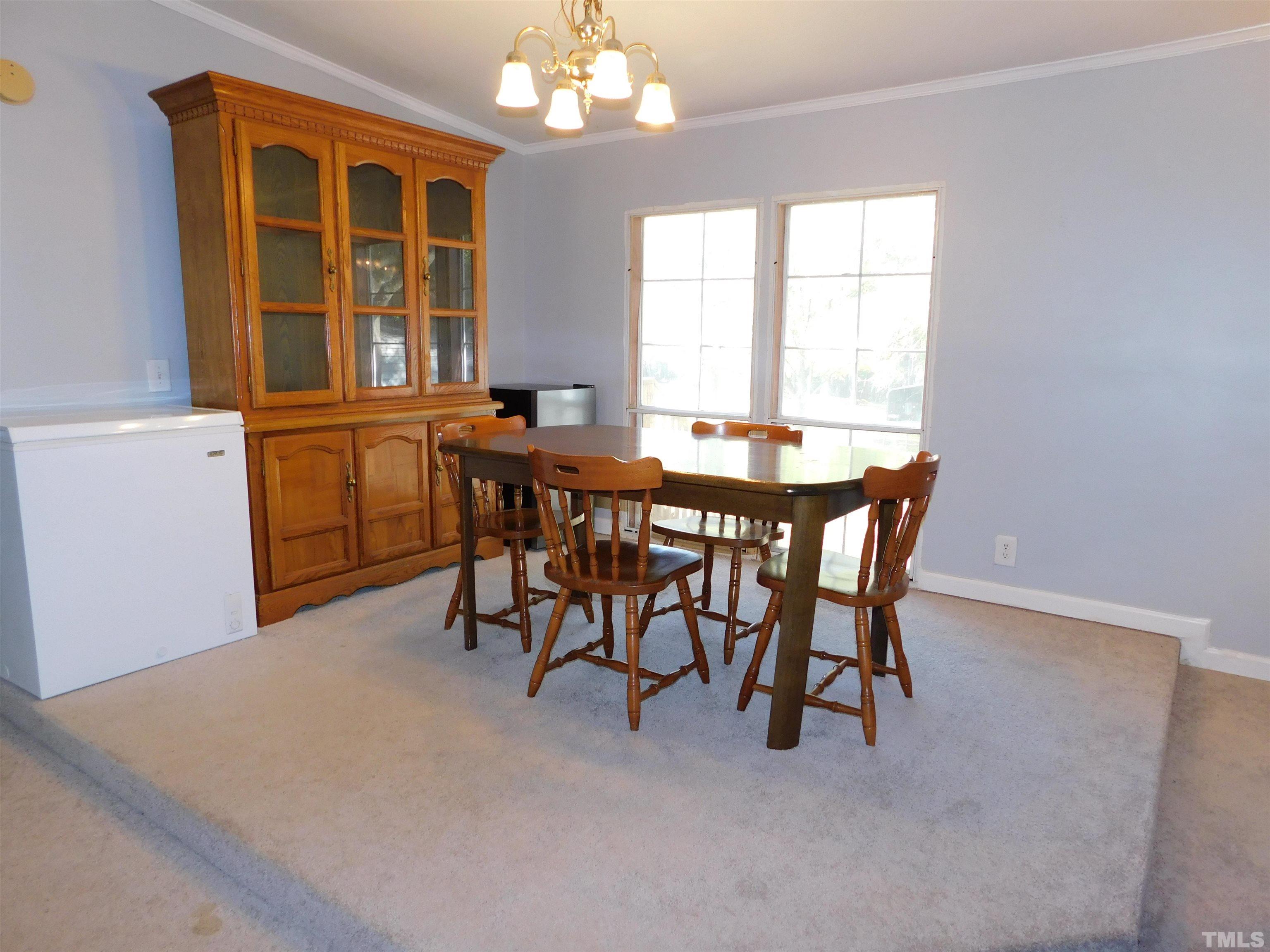 7180 Driver Road Zebulon, NC 27597 - Photo 5 of 19 a dining room with furniture and window