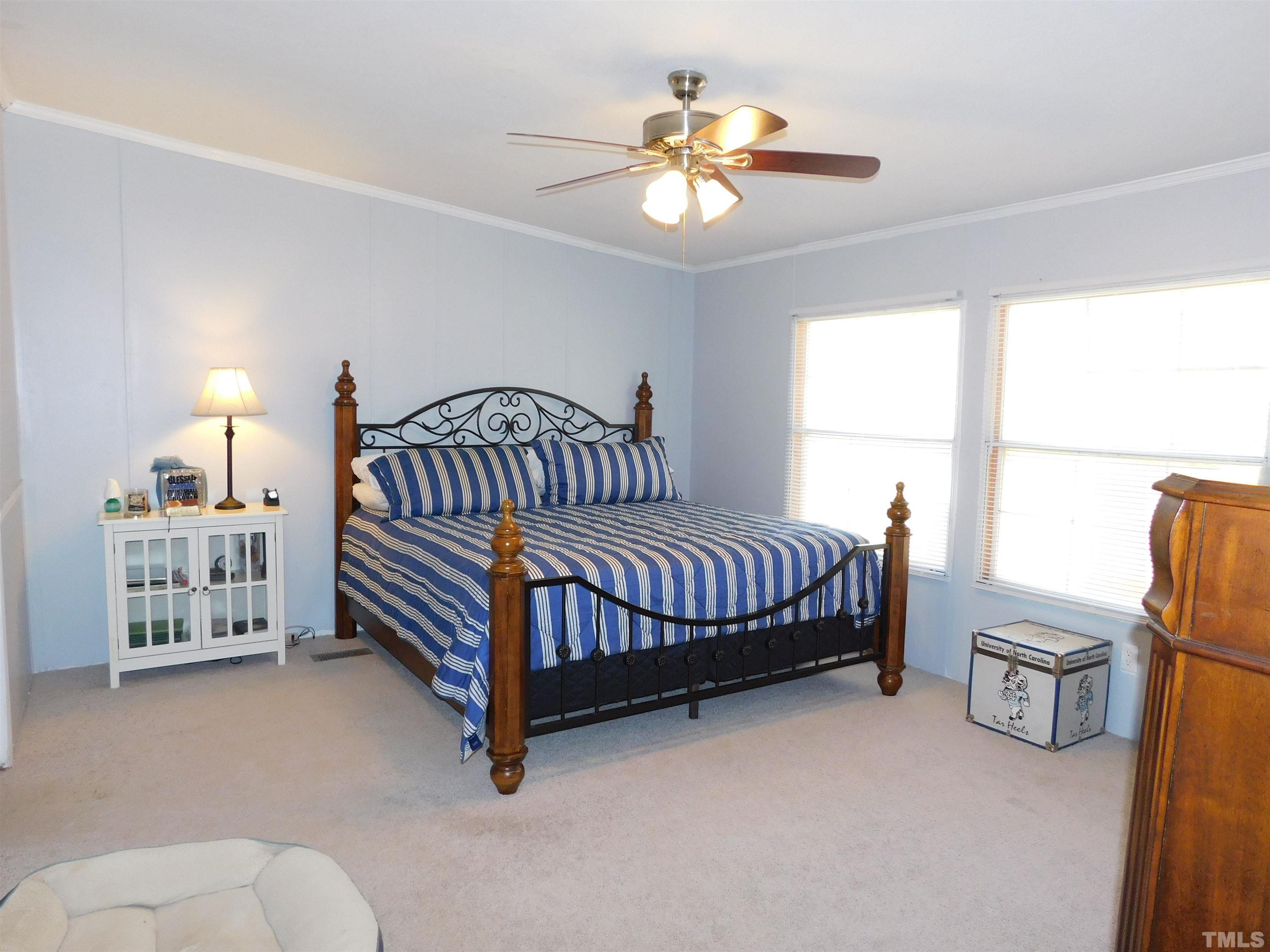 7180 Driver Road Zebulon, NC 27597 - Photo 10 of 19 a bedroom with furniture and a window