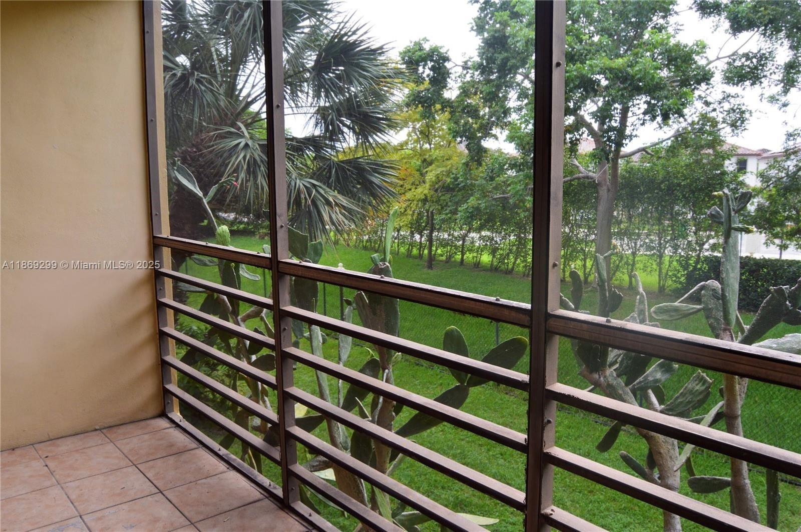 3490 Foxcroft Road, Unit B212 Miramar, FL 33025 - Photo 18 of 21 a view of a balcony with a pot