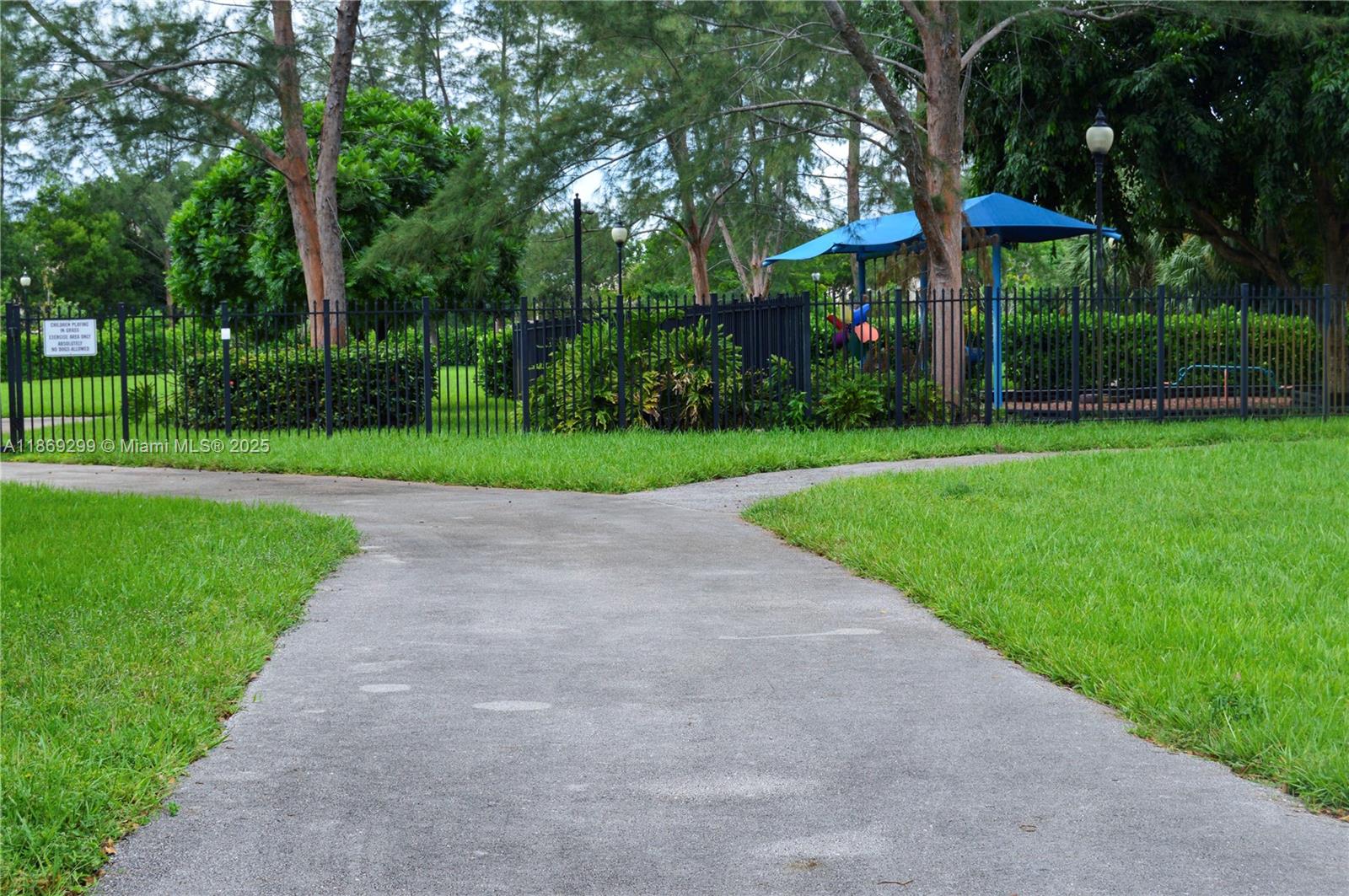 3490 Foxcroft Road, Unit B212 Miramar, FL 33025 - Photo 21 of 21 a view of a park with large trees