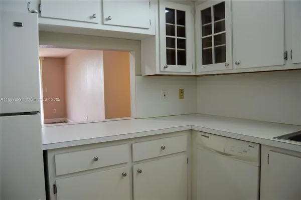 a view of cabinets and window