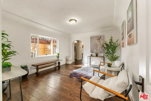 a kitchen with stainless steel appliances granite countertop wooden cabinets a oven and granite counter tops with a large window