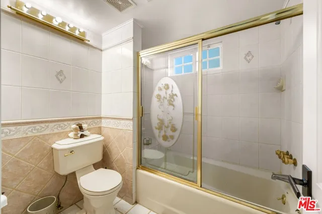 a living room with fireplace furniture and a wooden floor