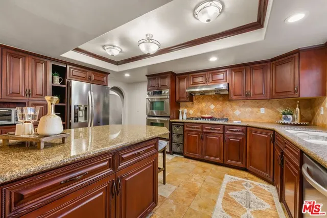 a view of a chairs and tables in the back yard of the house