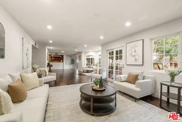 swimming pool view with a seating space