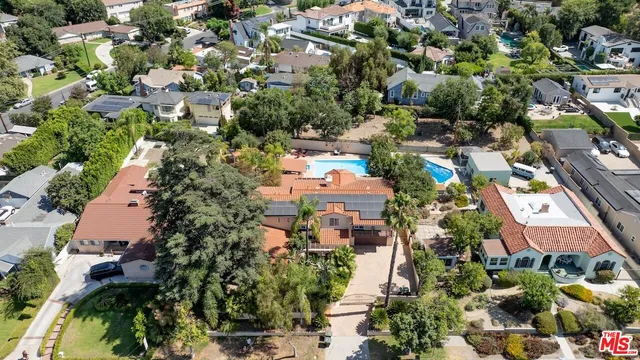 a view of a porch with potted plants